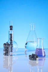 Photo for advertise cosmetic extracted from blueberry with laboratory layout. Fresh blueberry...
