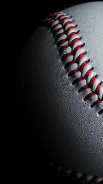 Close up of rotating baseball with black background.	
