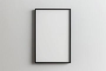 
A black picture frame on a white wall provides a perfect blank canvas for displaying artwork, photos, or posters in a modern and minimalist setting