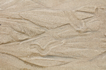 Patterns in beach sand for backgrounds
