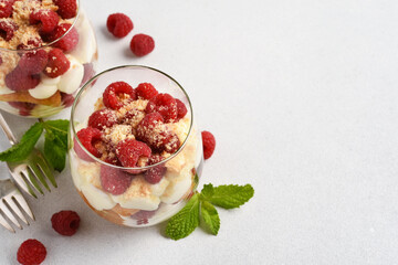 Tiramisu. Dessert with raspberries in a glass.