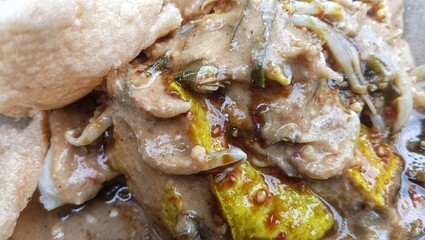 kupat tahu.Authentic Indonesian food containing lontong, bean sprouts, fried tofu and drizzled with peanut sauce.