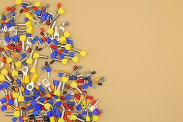 Metal tips with a plastic insulator for connecting copper electrical wires. Close-up. Soft focus. 