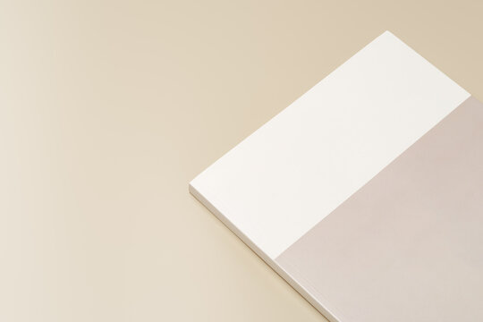 Stack of blank paper on beige background