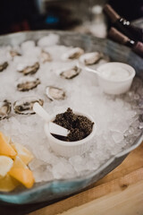 caviar, chips and oysters on ice