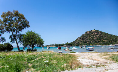 Fishing boats in the sea in sunny windy weather