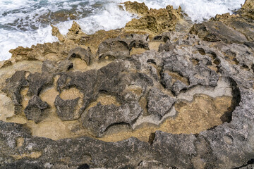  Ko Olina Beach Park, Leeward Coast of Oahu, Honolulu, Hawaii geology. Beachrock is a friable to well-cemented sedimentary rock. Salt weathering Tafoni
