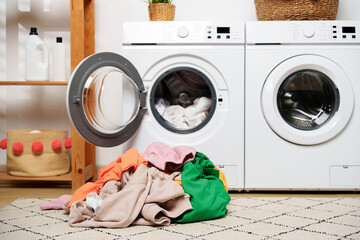 Laundry Day in a Modern Home With White Washers and a Wooden Shelf © fotofabrika