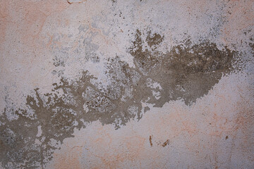 Worn out wall with peeling paint and faded colors. thin wall cracks,