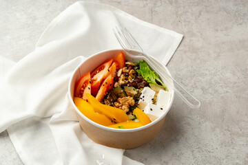 Tasty poke bowls on gray textured surface