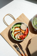 Take out poke bowl with craft bag on white background