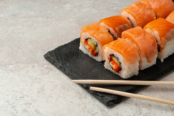 Close up of sushi rolls on gray table