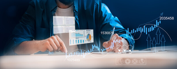 A businessman utilizes a tablet to analyze sales data, financial reports, and business growth graphs, focusing on digital marketing planning, strategy, financial reports, and investment concepts.