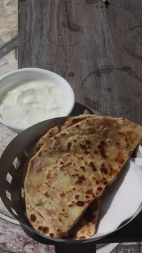 Popular Indian food Aloo Paratha with yogurt and pickles aloo paratha with curd