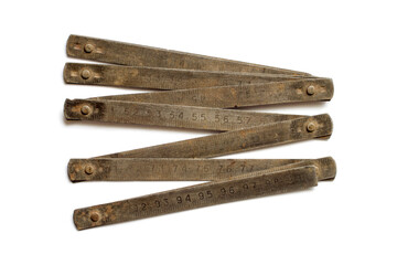 Old metal measuring meter on a white background. An old rusty measuring tool.