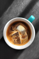 Directly above view a cup of ice coffee