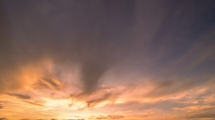 Panoramic view of sunset golden and blue sky nature background.
Colorful dramatic sky with cloud at sunset.Sky background.Sky with clouds at sunset.