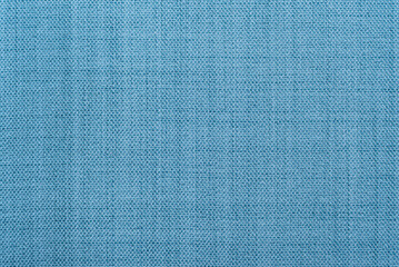 The texture of the fabric is light blue. Linen material. Textile