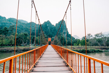 Obraz premium Orange bridge over song river Landmark in Vang Vieng,Laos 