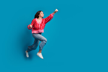 Full size photo of overjoyed positive woman dressed knitwear cardigan fly forward look empty space...