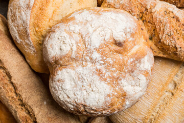 Homemade natural breads. Different kinds of fresh bread as background, top view with copy space