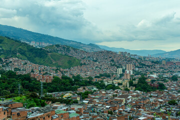 Medellin, Medellín, Antioquia : Panoramic view of Medellin from the Comuna 13 district. Clouds.