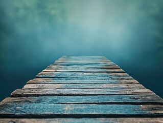 Fototapeta premium Eerie boardwalk leading into deep blue water. Suitable for fantasy, night, or underwater-themed photography.