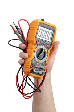 Hand holding a yellow digital multimeter with test leads, isolated on a white background