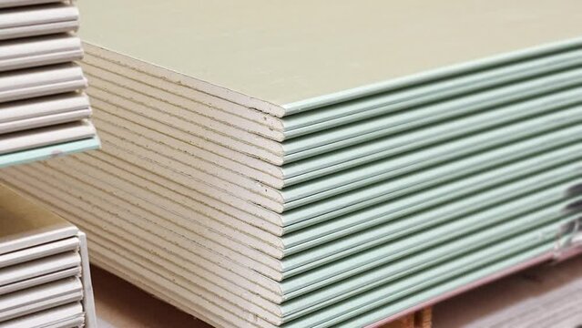  water repellent gypsum board on a rack in a hardware store. sale of building materials for repair and construction.