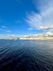 Fantastic white clouds at the city river, city river view, summer day