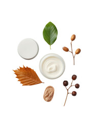 Top view of natural cosmetic cream with botanical elements including leaves, nuts, and berries on white background. isolated white background, transparent background, PNG