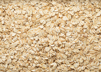 Organic healthy oatmeal cereal flakes textured background.Macro.