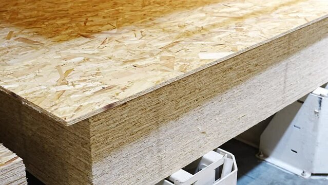 OSB board on a rack in a hardware store. sale of building materials for repair and construction. Oriented Strand Board