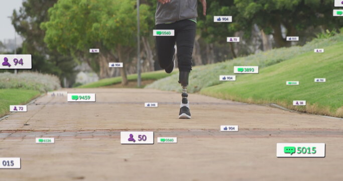 Image of notifications, low section of african american man with prosthetic leg running in park