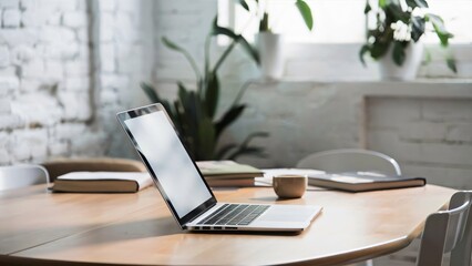 A photo of a laptop sitting on a wooden table, showcasing a blank white screen