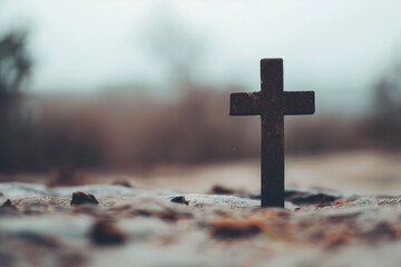 Worn Cross Stand on Earth with Blurred Outdoor Background