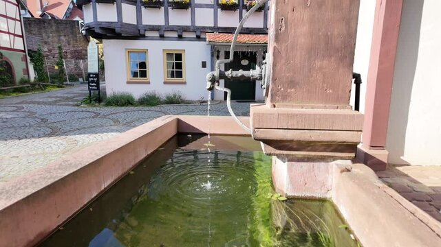The buildings of the German city of Michelstadt, Well with water.