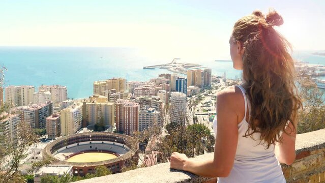 Woman tourist enjoying panoramic view of Malaga- Spain