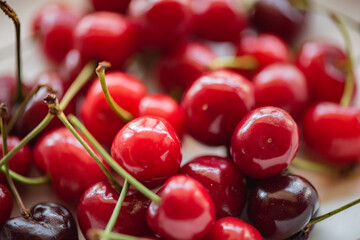 On the plate and the cherry in hand