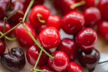 On the plate and the cherry in hand