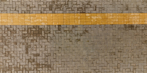 top view of the surface of wet paving slabs and pedestrian footpath after rain