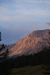 Golden Hour: Sunlit Mountain Peak at Dusk