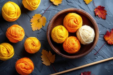  Holding a knitting needle over yarn on the right side of the screen, with a partially completed scarf on the left, a knitting needle is held in hand while stitches form 