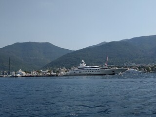 Landscape horizon viewpoint horizontal photography. Concept of Summer vacation trip. Montenegro. Yachts and mountains on the back. Copy space.