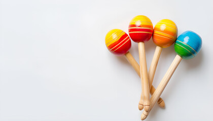 Colorful maracas on white background, top view. Musical instrument