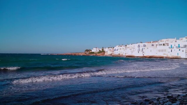 Sea view in Naousa of Paros island in Greece with some architecture cucladic houses at the coast