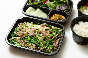 Stir-fried meat and side dishes in packaging containers, Korean food