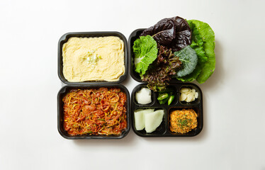 Take-out lunch box, spicy stir-fried meat and side dishes	