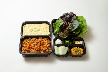 Take-out lunch box, spicy stir-fried meat and side dishes	