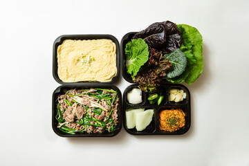 Stir-fried meat and side dishes in packaging containers, Korean food